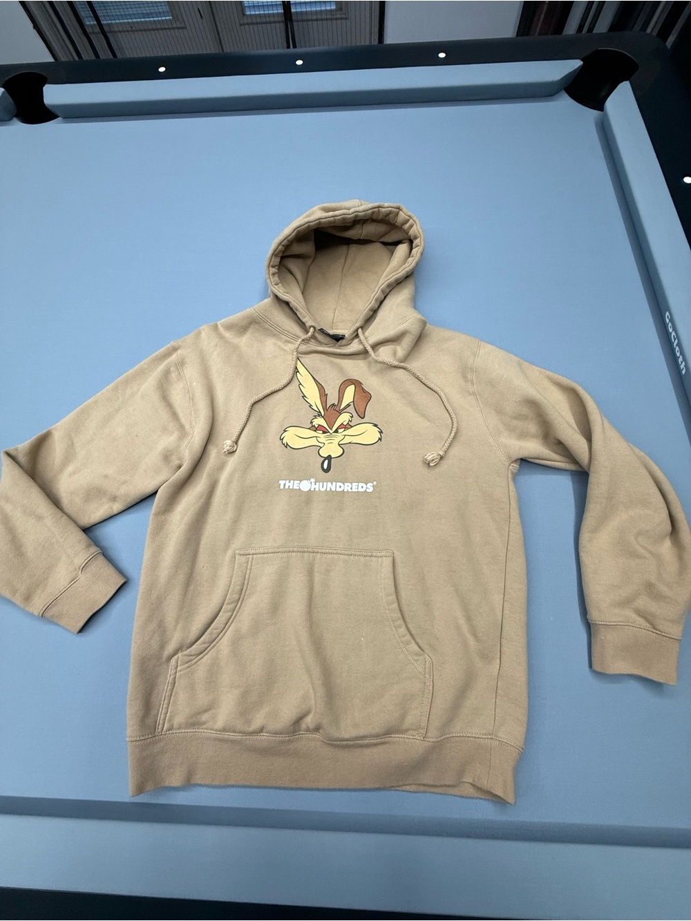 ACME Tan Pullover Hoodie with Cartoon Graphic